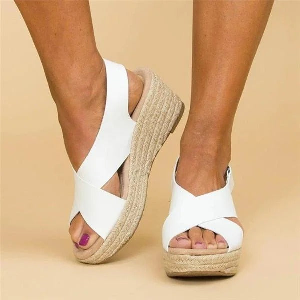 White Aeris women's wedge platform sandals with crossover straps and espadrille sole for effortless summer style.