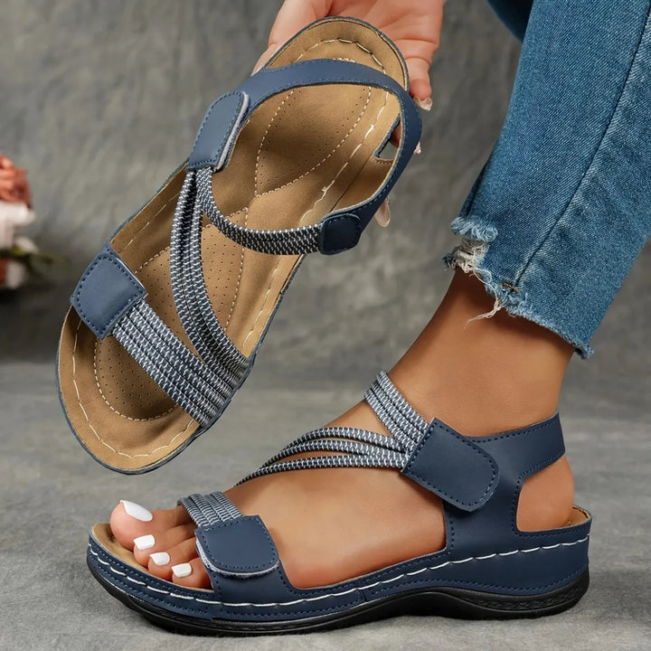Amalyn women's navy adjustable strap flat sandals with contrast stitching, perfect for warm-weather outfits.