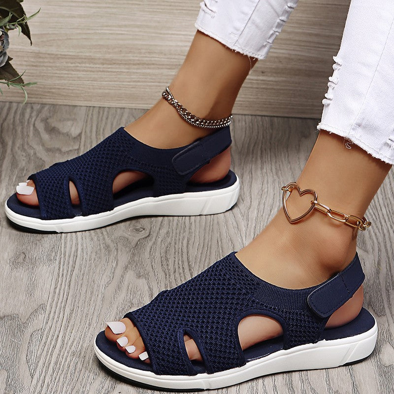 Amiel women's navy open-toe slingback sport sandals with a soft knit-style upper and white sporty sole.