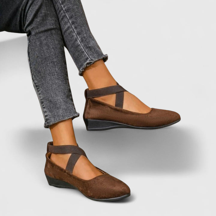 Clara women's brown orthopedic wedge strap flats with a closed toe and subtle lift for everyday comfort.