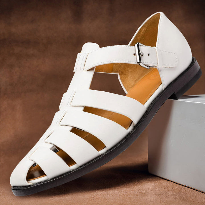 Clara white vegan leather fisherman sandals with closed-toe woven design and adjustable buckle strap.