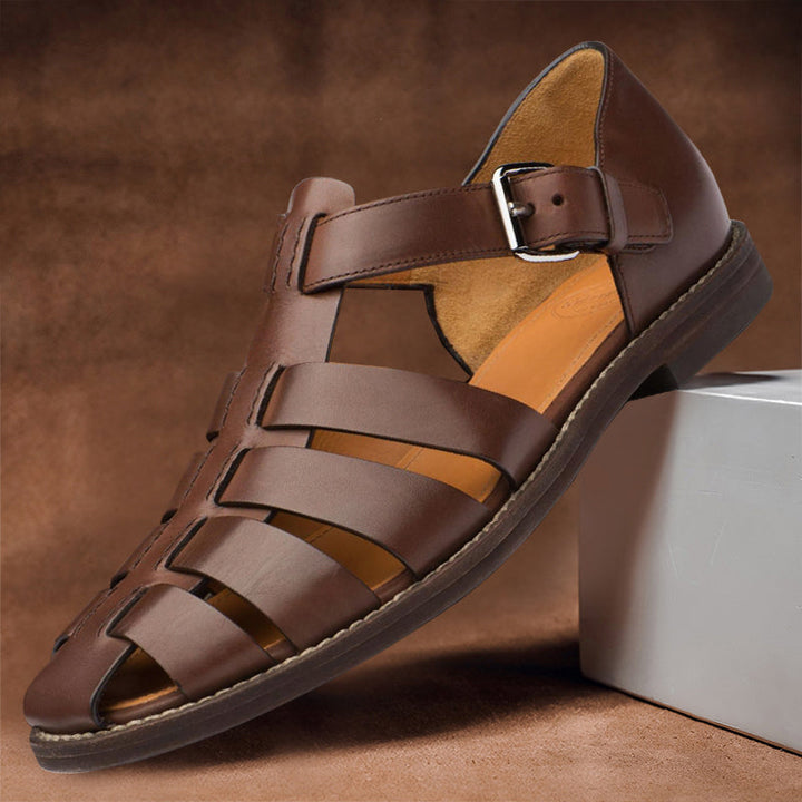 Clara women's vegan leather fisherman sandals in rich brown, featuring a closed-toe woven design and adjustable buckle strap.