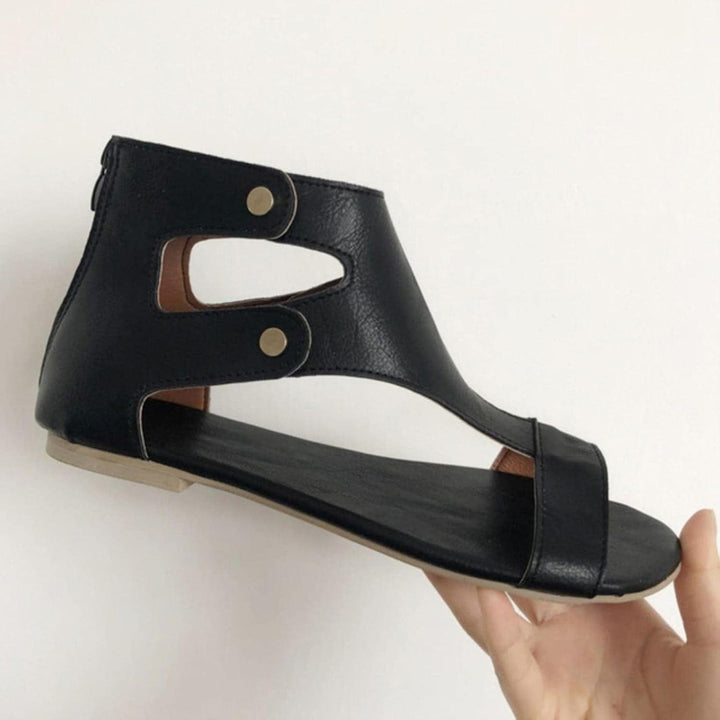 Delaney black women's cutout orthopedic ankle sandals with secure strap and gold accents.