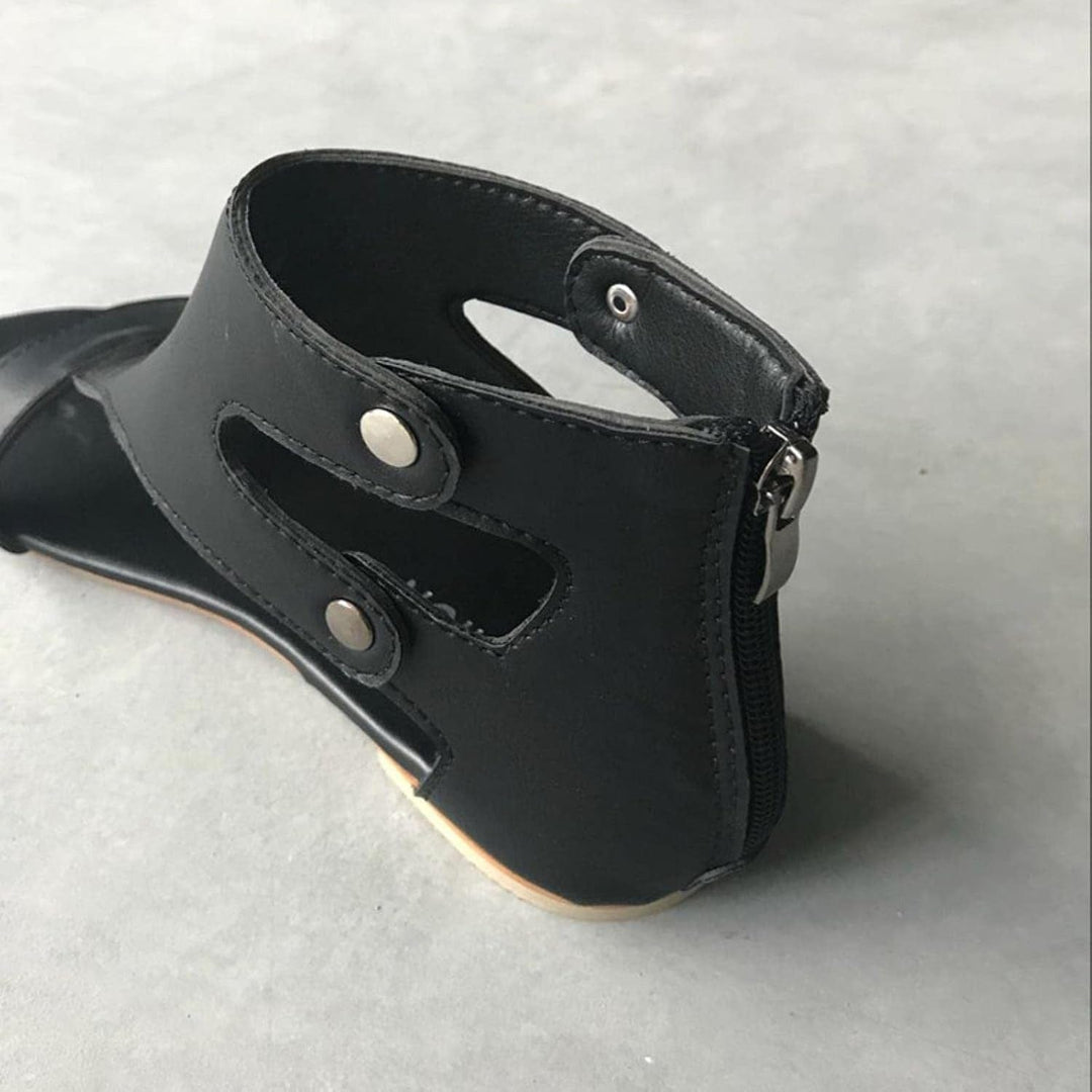 Black Delaney women's cutout orthopedic ankle sandals with secure strap, polished finish, and back zipper.