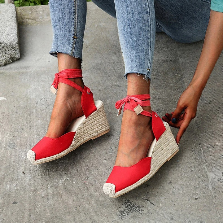 Red Elowen lace-up wedge espadrille sandals with closed toe, perfect for summer styling.
