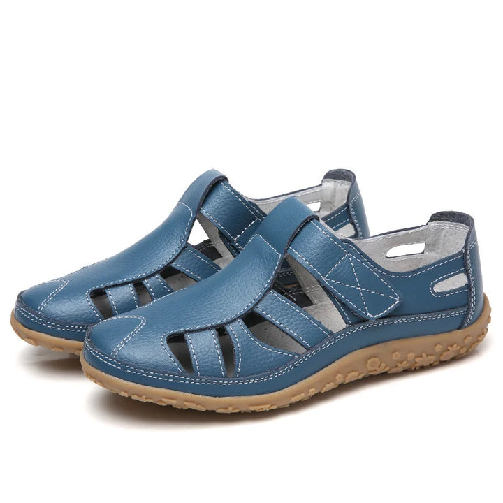 Emma women's closed-toe orthopedic walking sandals in blue leather with white stitching and a supportive brown sole.