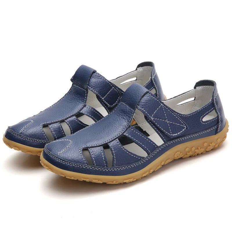 Emma women's closed-toe orthopedic walking sandals in navy blue leather with adjustable straps and supportive soles.