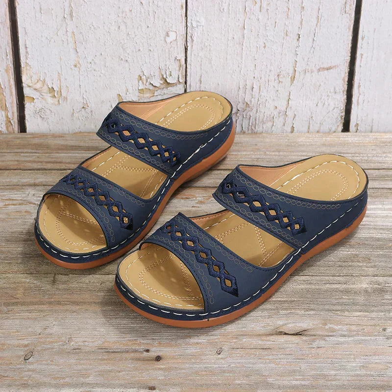 Ezra women's navy open-toe slip-on wedge sandals with cutout strap detailing and a comfortable low sole.