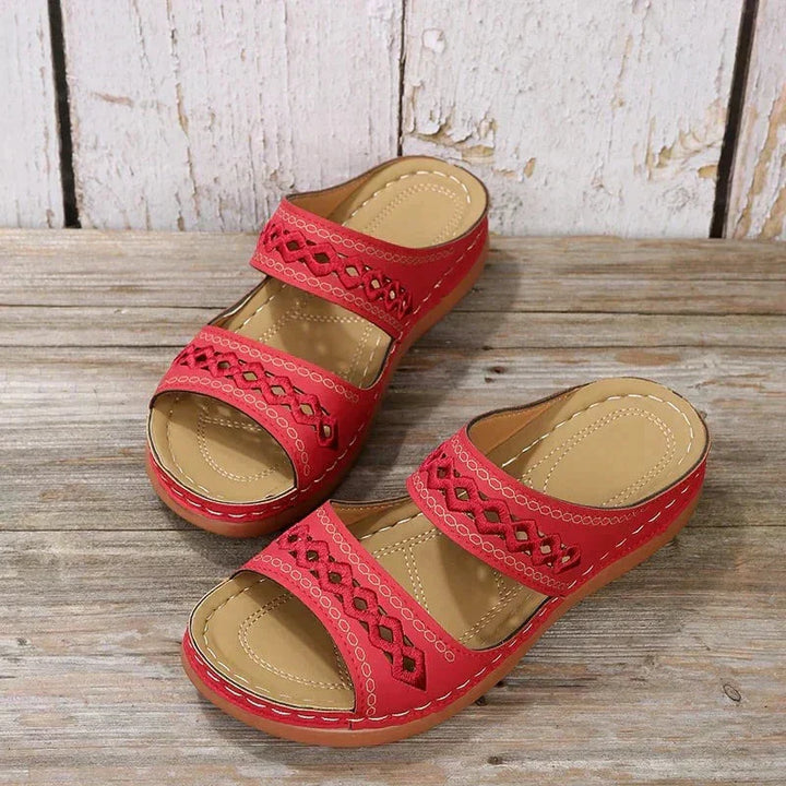 Red Ezra women's open-toe slip-on wedge sandals with cutout strap detailing and a low wedge sole.