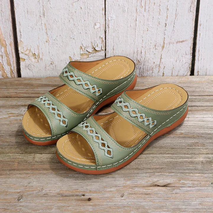 Ezra women's sage green open-toe slip-on wedge sandals with cutout strap detailing and a low wedge sole.