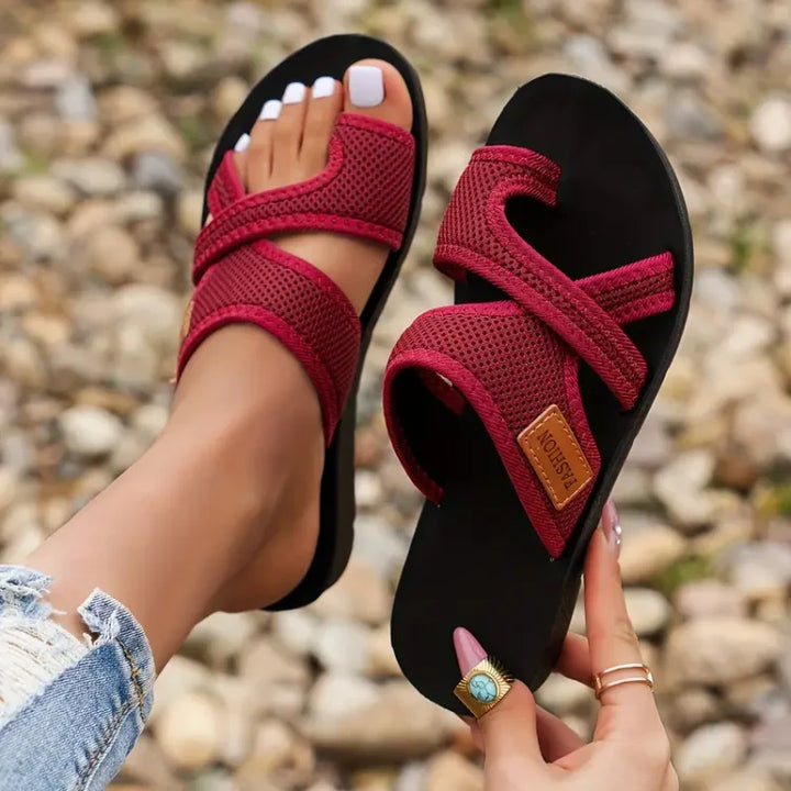 Kathleen women's mesh slide sandals in a rich red, featuring wide mesh straps and a flat black sole.