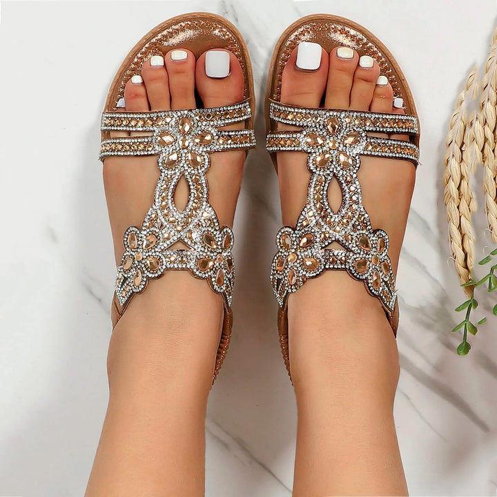 Marcella women's metallic T-strap sandals with sparkling beaded embellishments for effortless summer styling.