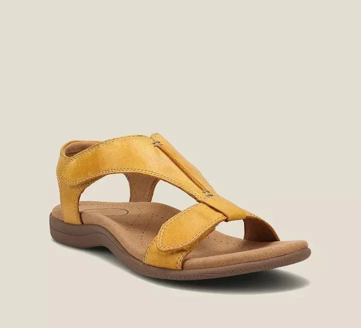 Maureen women's open-toe back strap sandals in a warm yellow hue, featuring adjustable straps and a flat sole.