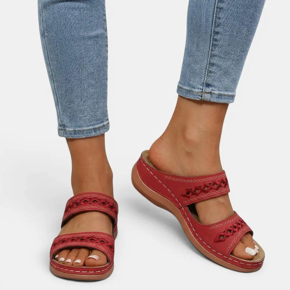 Mia women's red double strap orthopedic slide sandals with cutout detailing and cushioned sole.