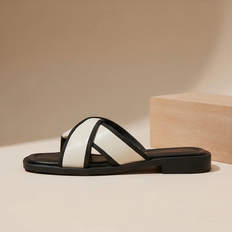 Nerissa women's cross strap slide sandals with white and black contrast trim, square toe, and slip-on style.