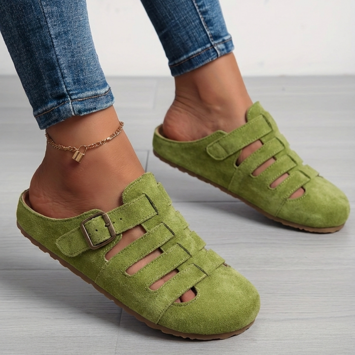 Nora women's slip-on mule sandals in vibrant green suede with a closed toe, cutout detailing, and buckle strap.