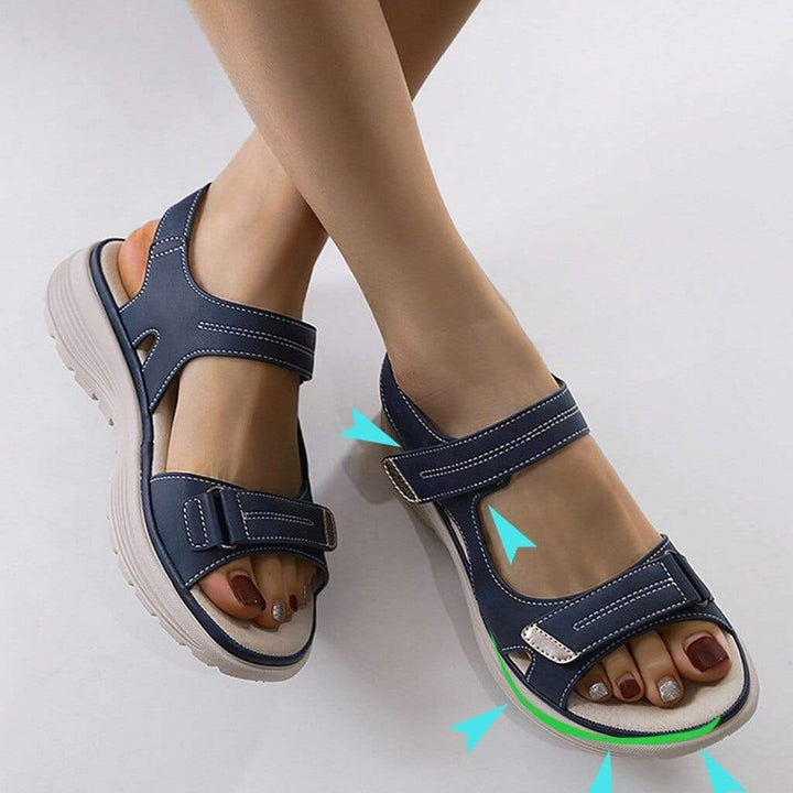 Orlena women's navy adjustable wedge sandals with contrast stitching and open toe, offering easy support.