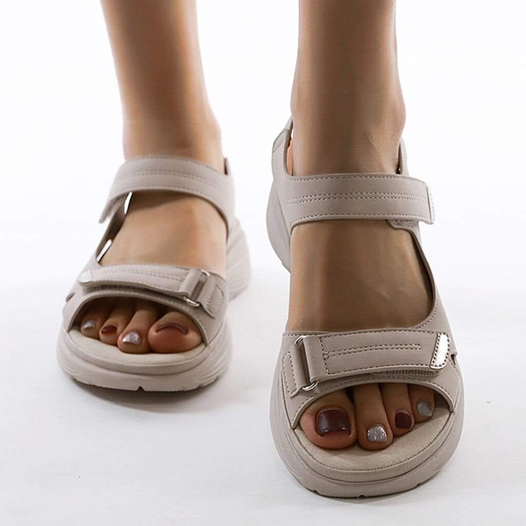 Orlena women's adjustable wedge sandals in a versatile beige, featuring an open toe and secure strap styling.