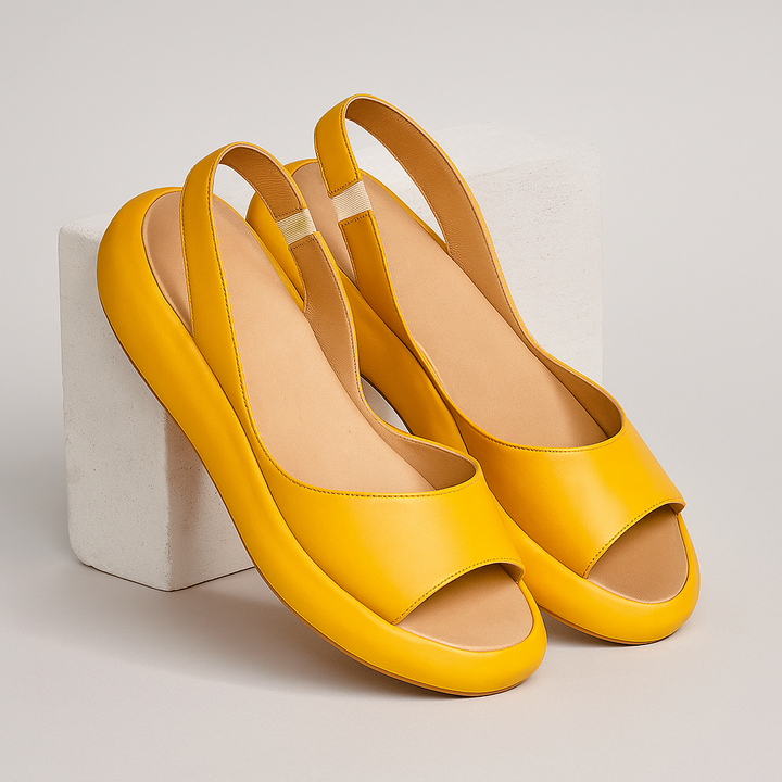 Ottilie women's bright yellow open-toe leather slingback sandals with a low platform sole.