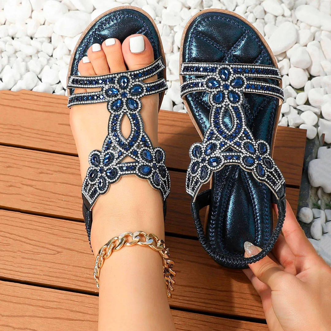 Sapphira women's flat sandals in navy with ornate blue and silver beaded detailing, perfect for summer styling.