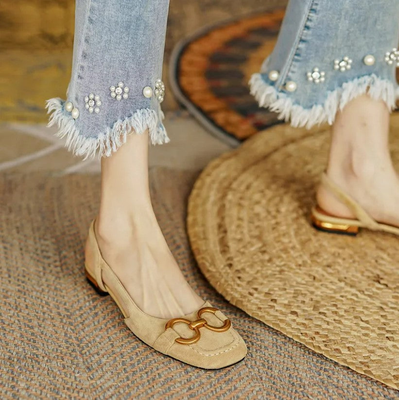 Verena women's beige slingback buckle flats with a gold-tone buckle, closed toe, and low flat heel.