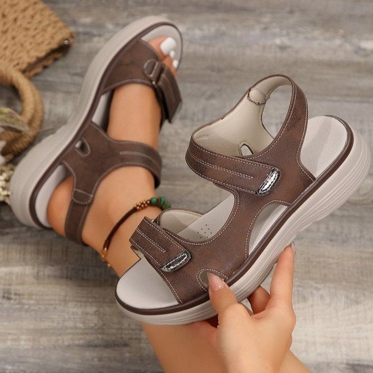 Xaviera women's brown adjustable platform sandals with contrast stitching, open toe, and secure strap styling.