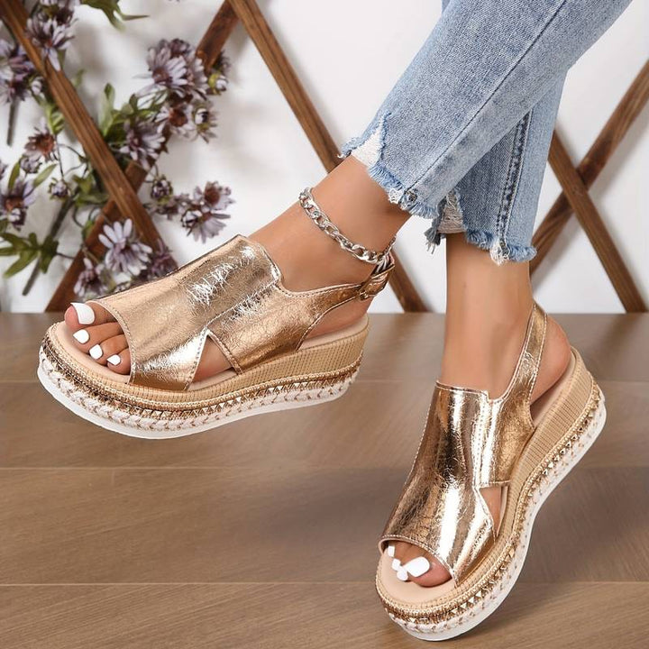 Women's Zafira metallic gold platform wedge sandals with open toe, slingback strap, and braided sole.