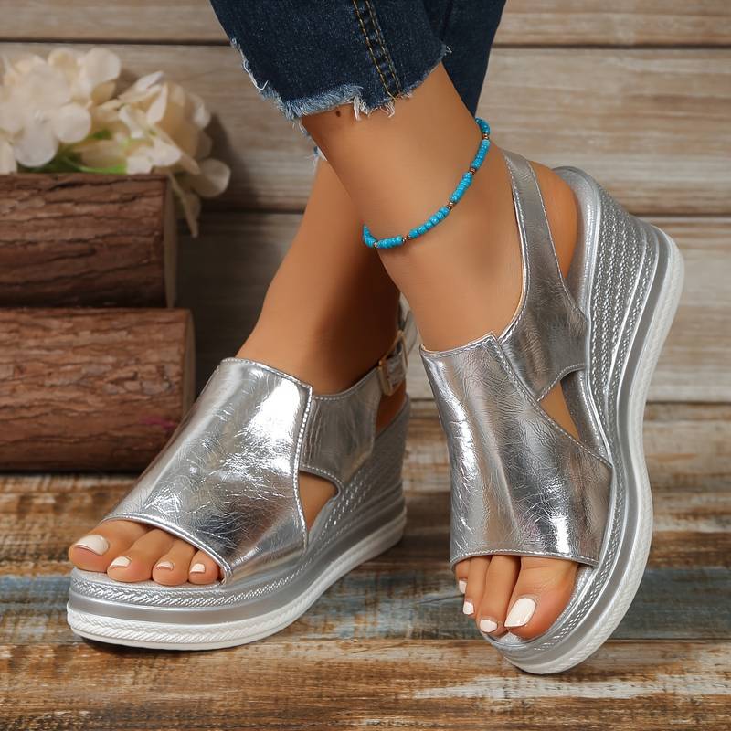 Women's Zafira metallic silver platform wedge sandals with open toe and slingback strap.