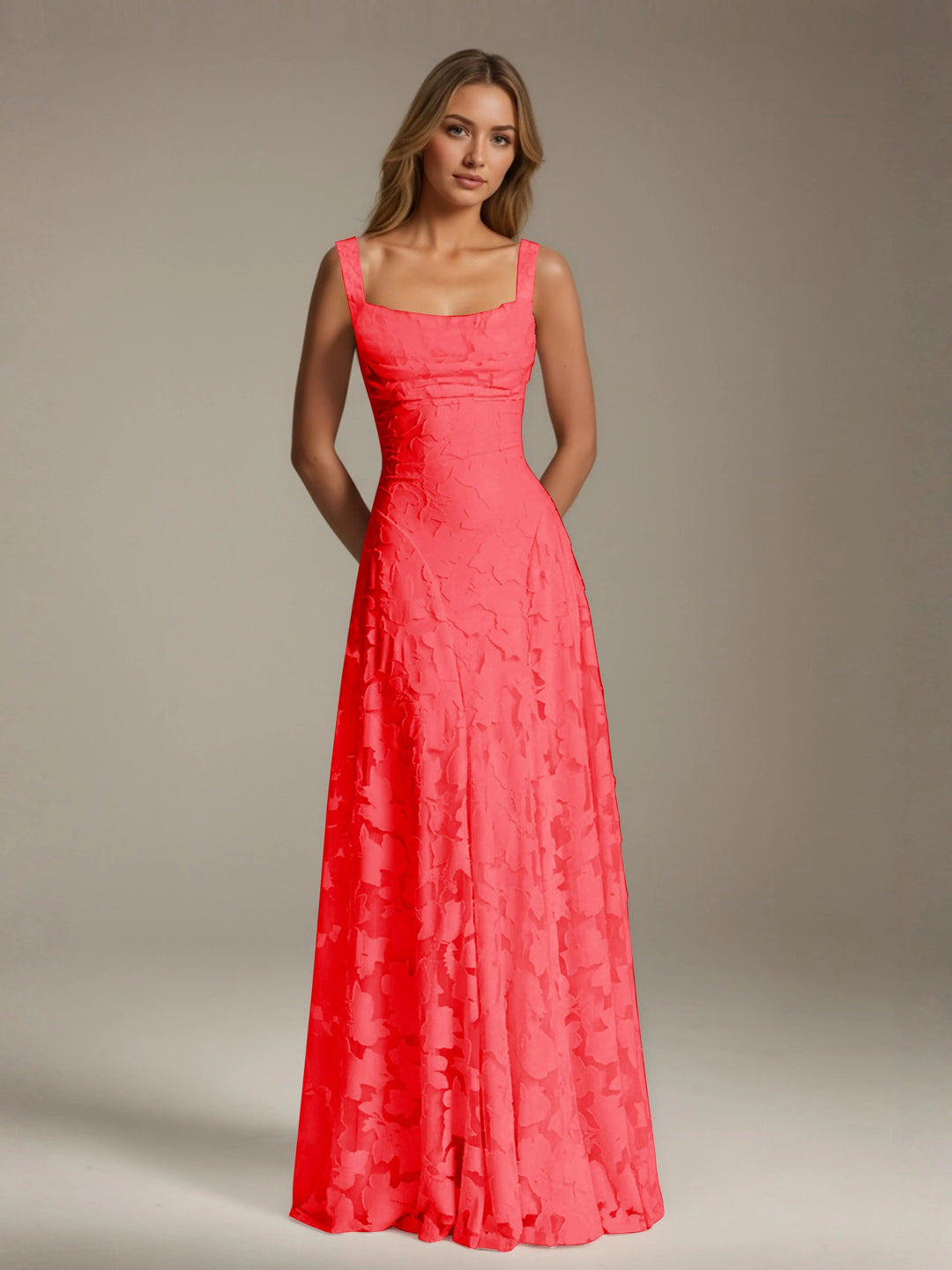Adrienne coral floral lace A-line bridesmaid gown with square neckline and flowing floor-length skirt.