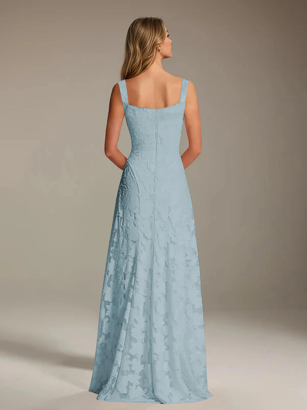 Adrienne light blue floral lace A-line bridesmaid gown with square neckline, seen from the back.