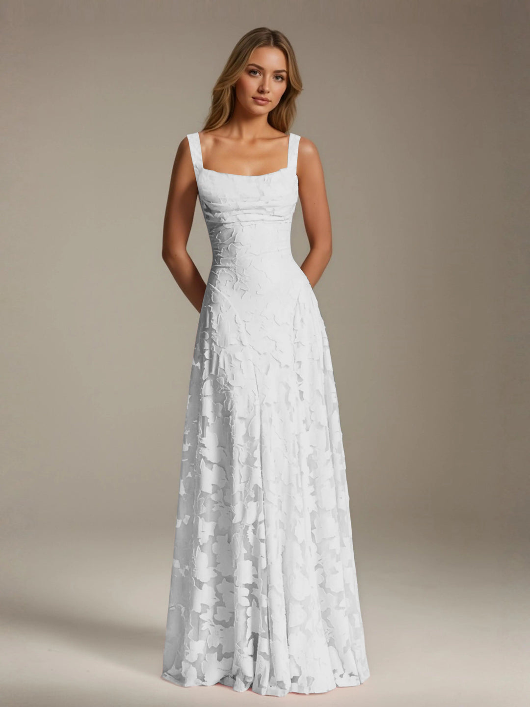Adrienne white floral lace A-line bridesmaid gown with square neckline and flowing skirt.