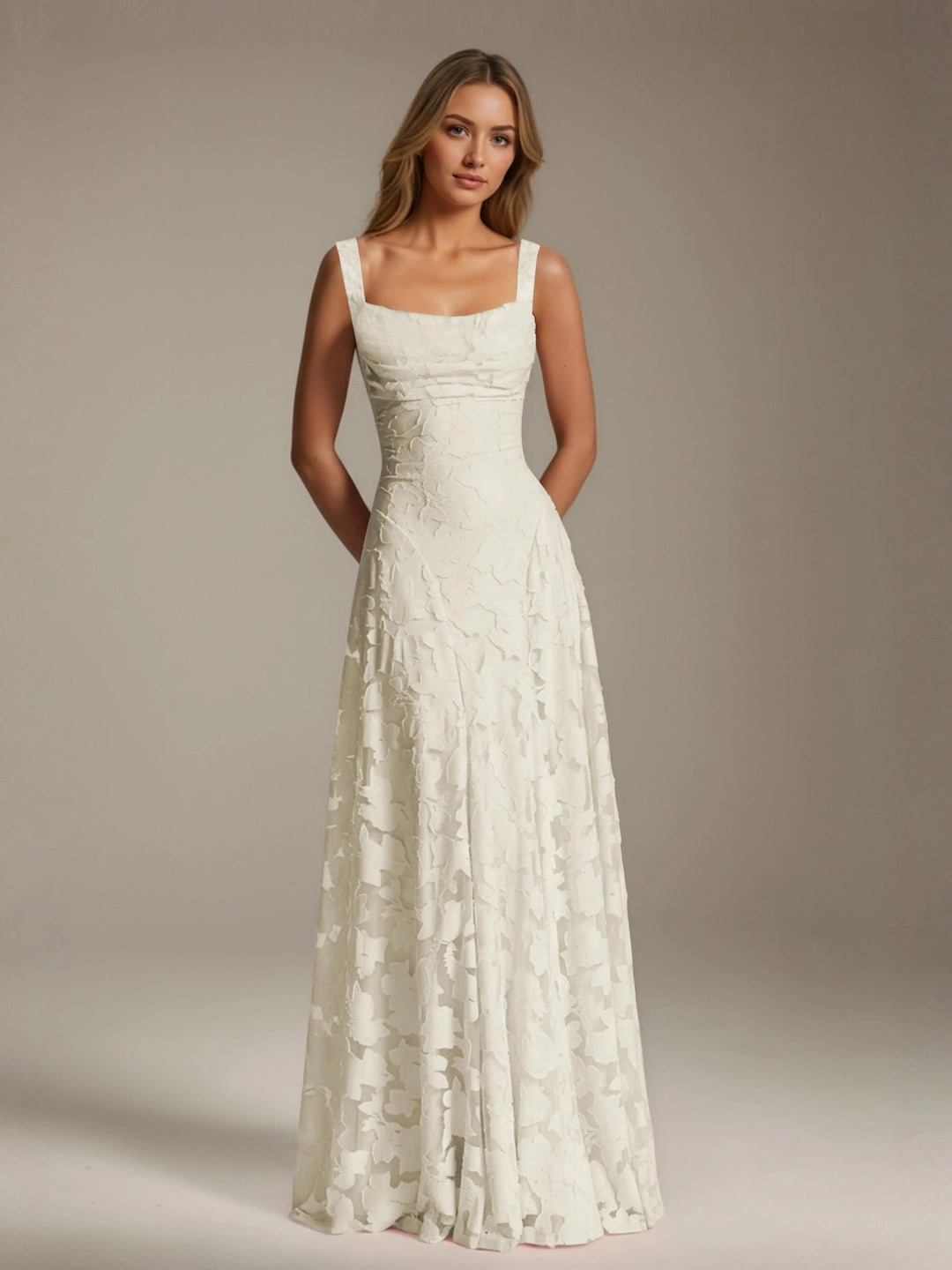Adrienne white floral lace A-line bridesmaid dress with square neckline and flowing floor-length skirt.