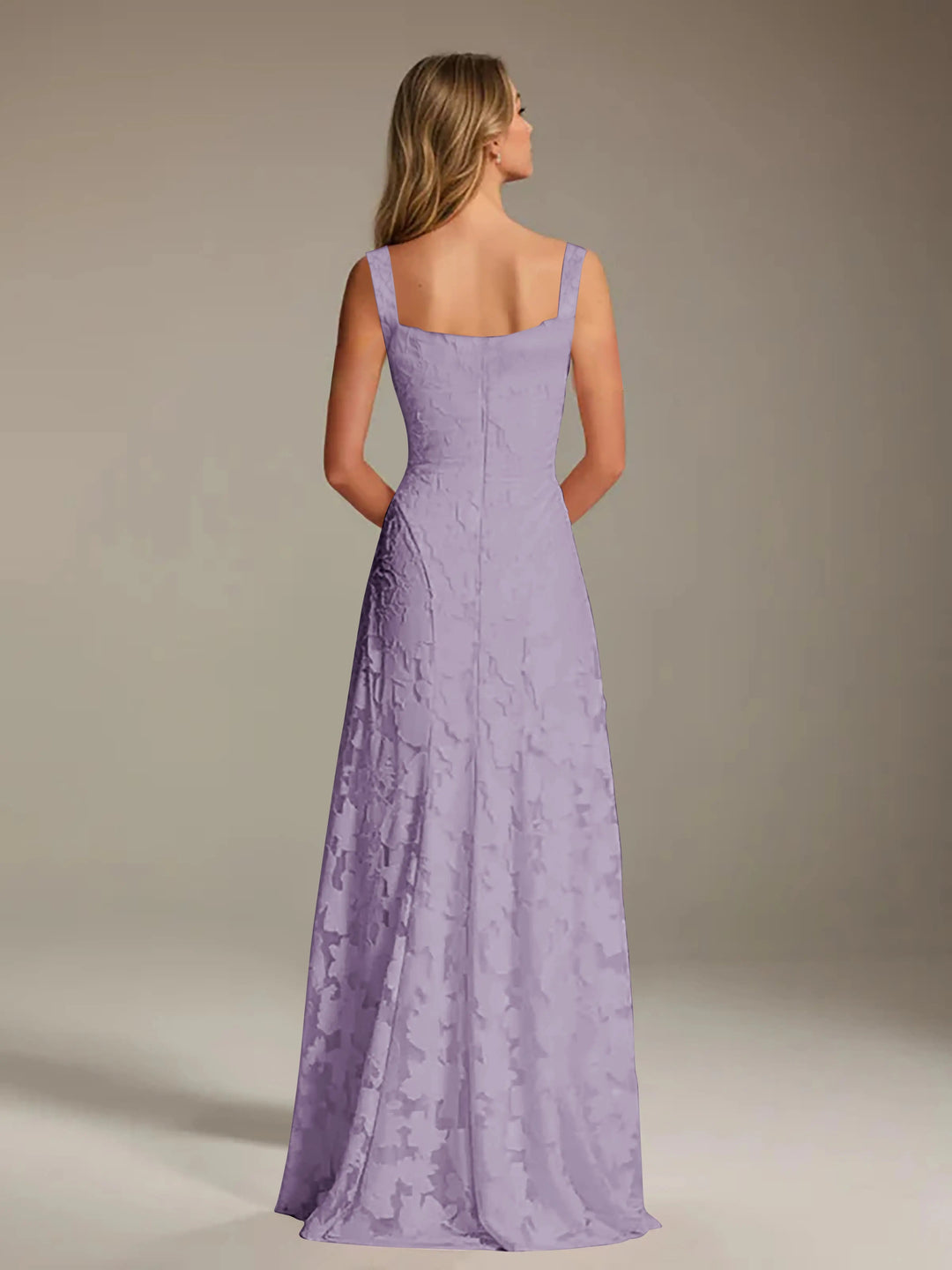 Adrienne A-line floral lace bridesmaid gown in lavender with a square neckline, viewed from the back.