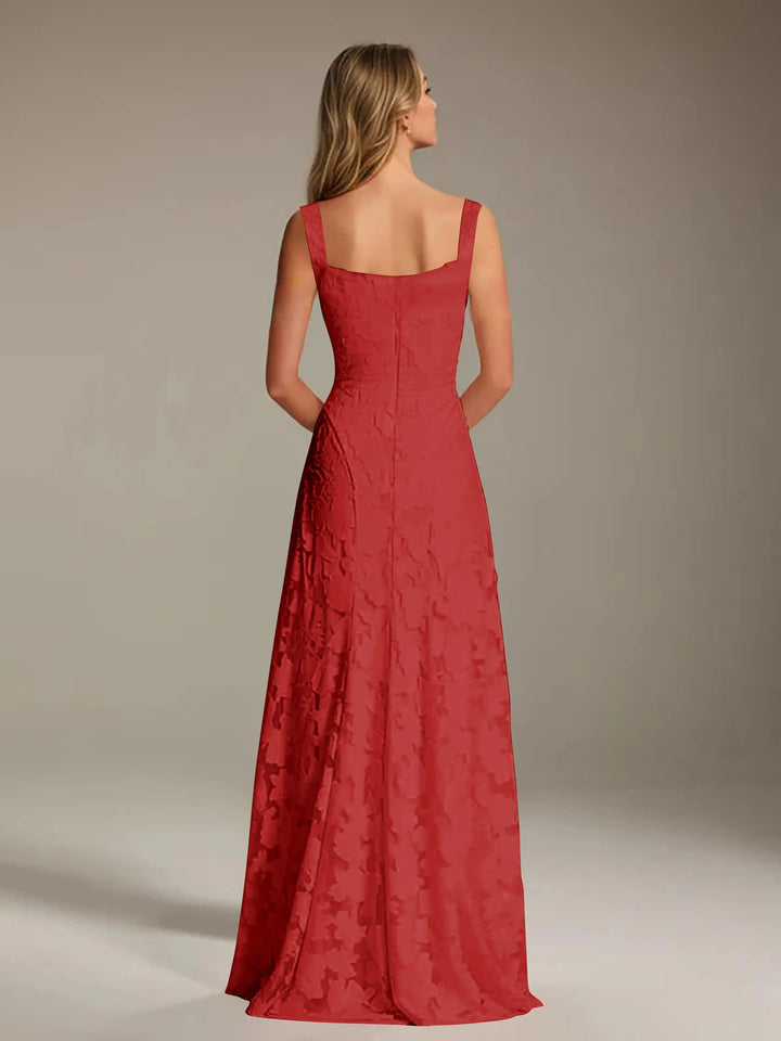Woman from behind in a red floral lace A-line bridesmaid dress with a square neckline.