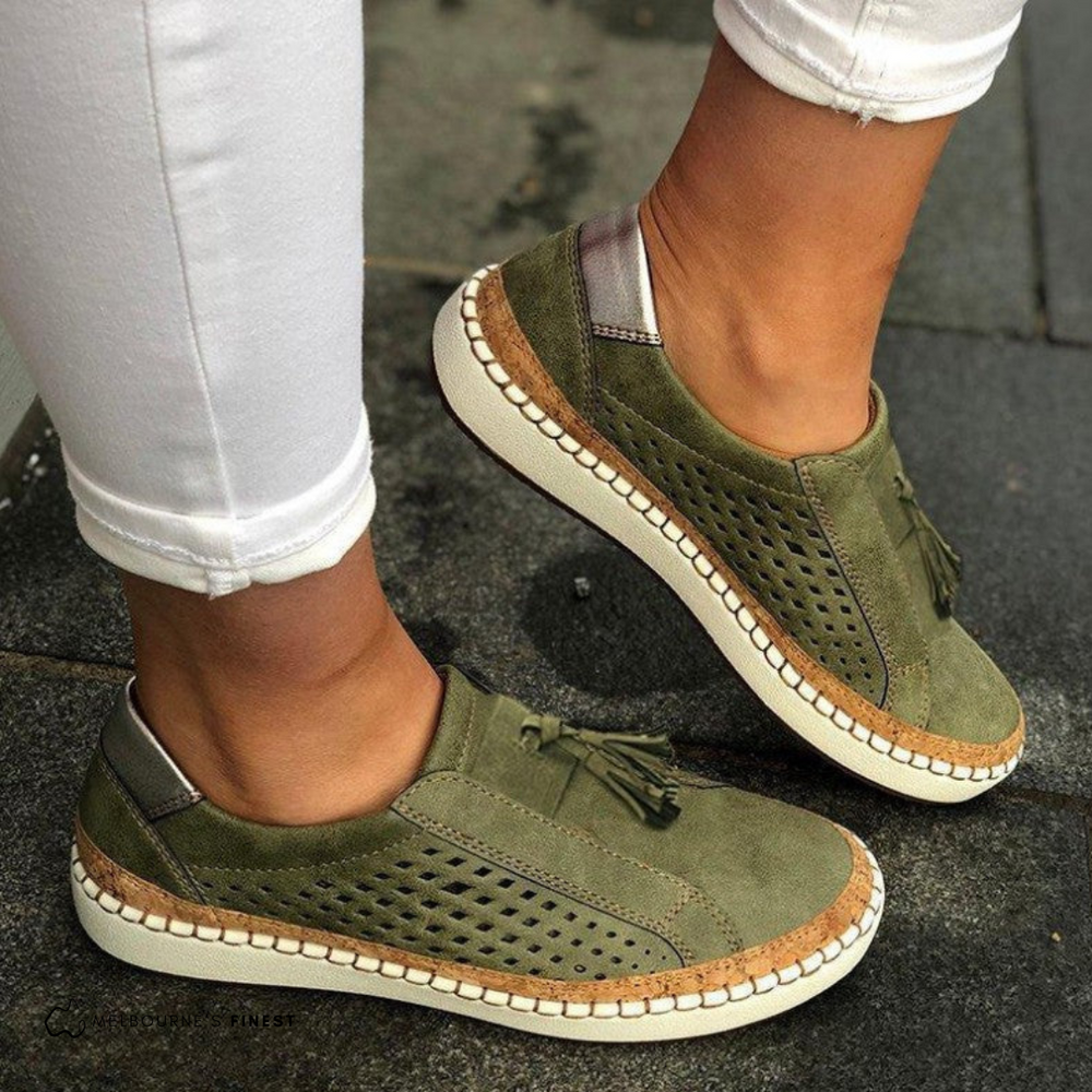 Green Amari women's orthopedic slip-on shoes with arch support, side view.