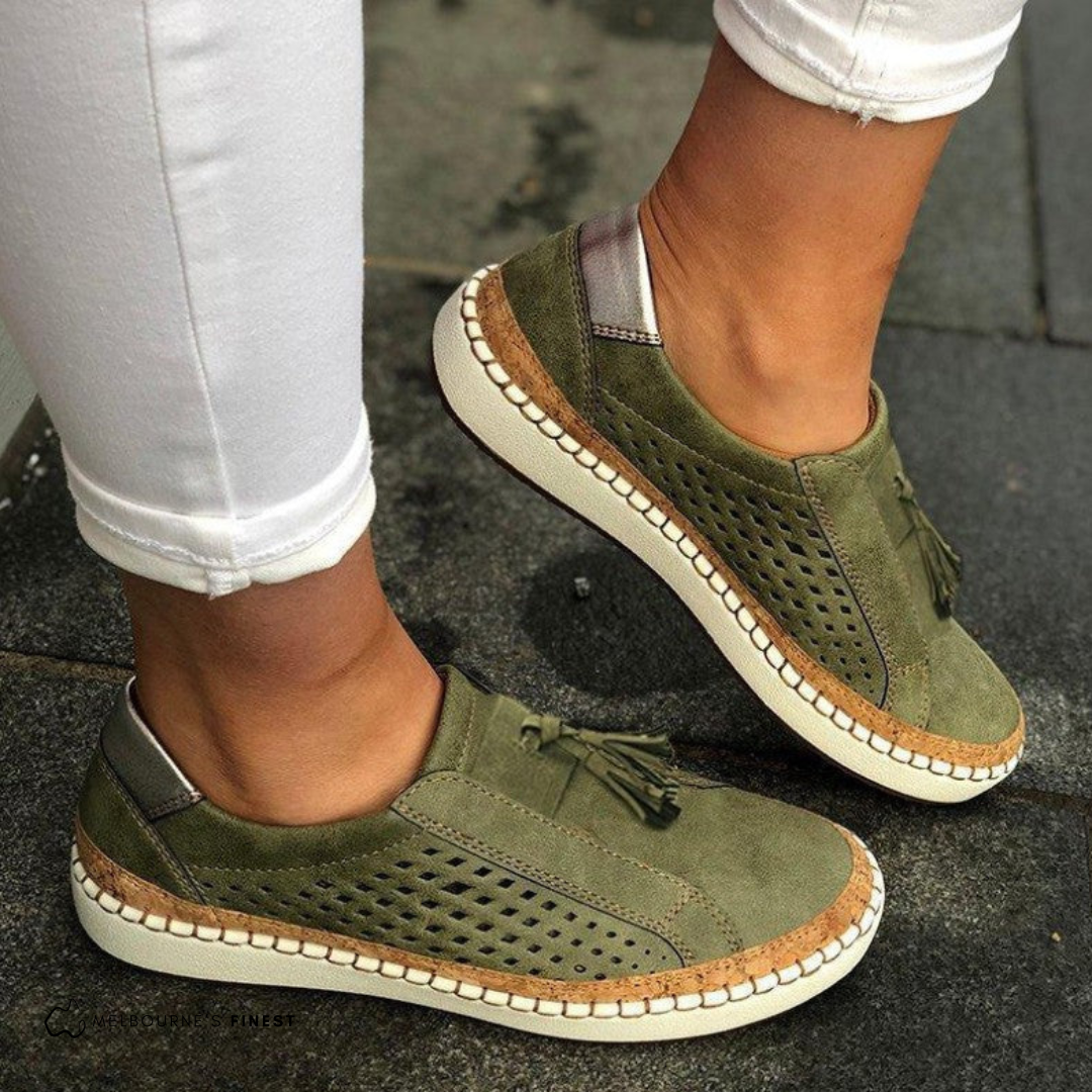 Green Amari women's orthopedic slip-on shoes with arch support, side view.