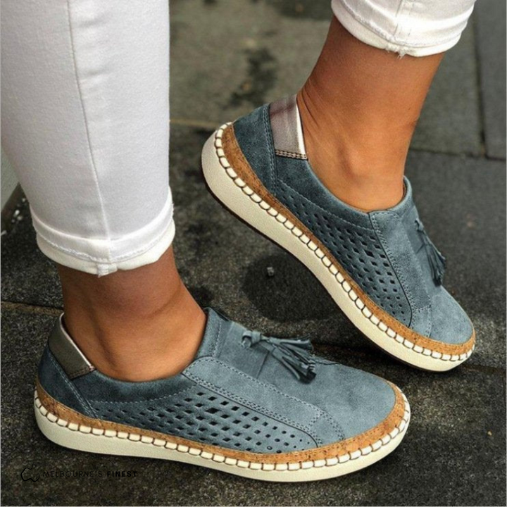 Amari women's blue orthopedic slip-on shoes with arch support, side view.