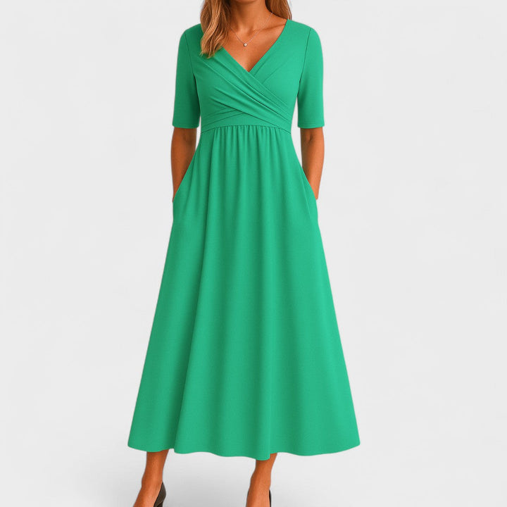 Amaya women's green V-neck wrap-style midi dress with elbow sleeves and side pockets.