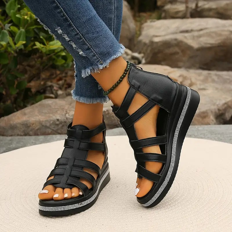 Black women's platform gladiator sandals with strappy upper, open toe, and rhinestone trim.