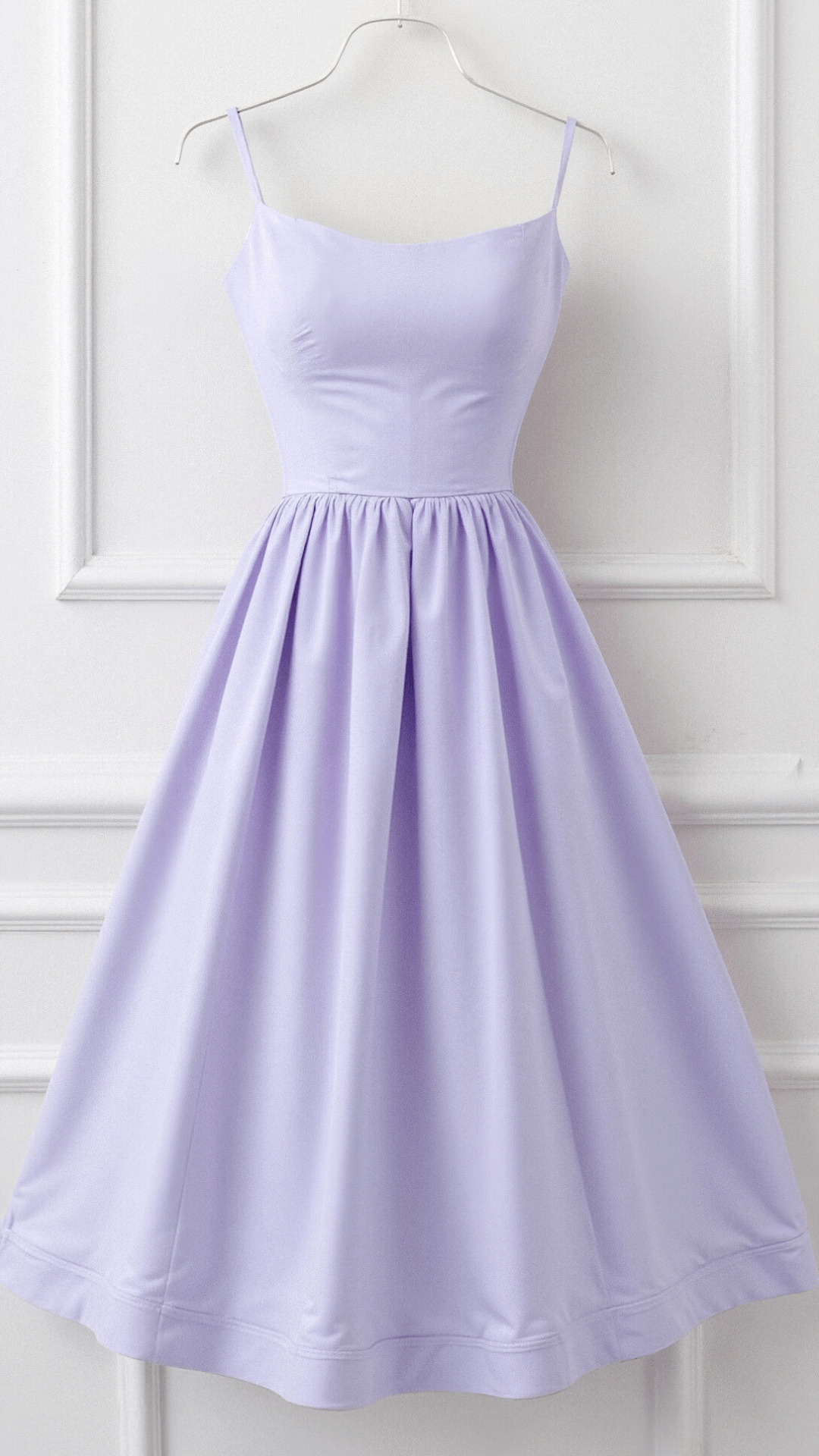 Purple Arabella A-line midi dress with spaghetti straps, flowing fabric, and elegant design.