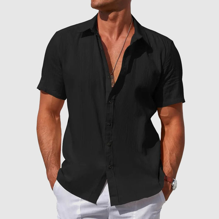 Men's black Asher short sleeve linen button-up shirt with subtle textured stripes and a classic collar.