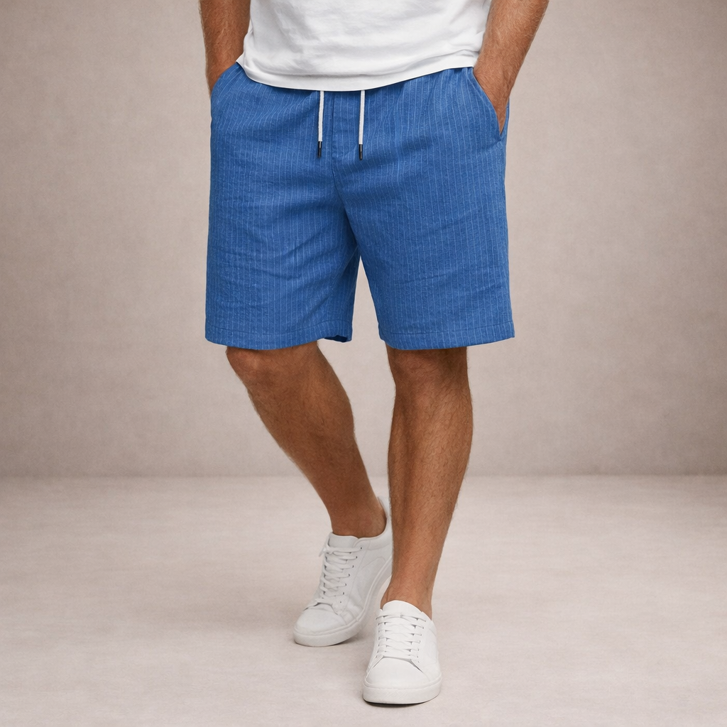 Men's Brandon blue pinstripe linen drawstring shorts with side pockets, worn with a white tee and sneakers.