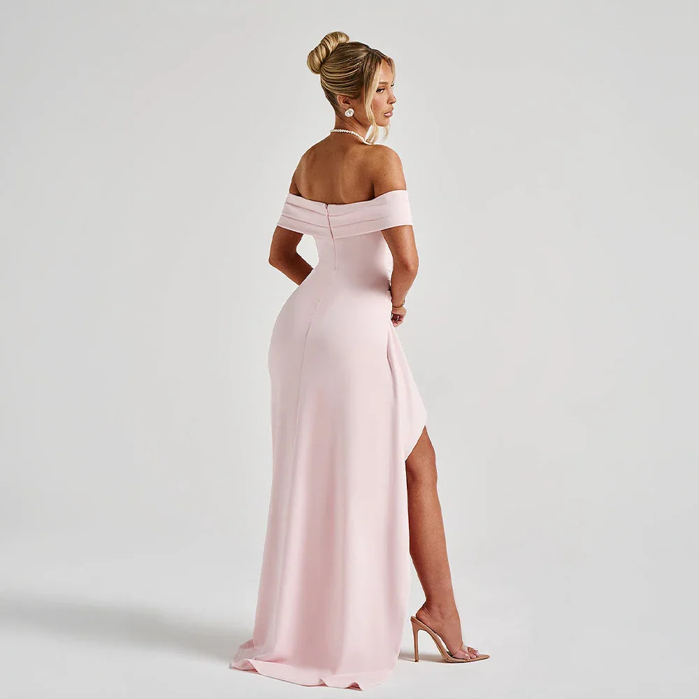 Red off-shoulder maxi dress with a high slit, flowing fabric, and elegant design.