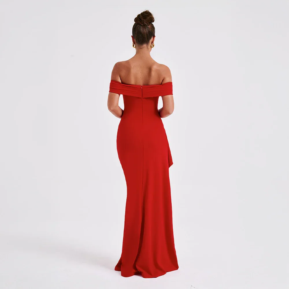 Women's black off-shoulder maxi dress with a high slit, flowing fabric.