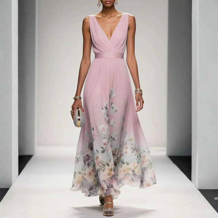Britta women's pink floral V-neck sleeveless maxi dress with flowing skirt, worn by a model.
