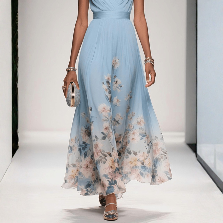 Britta women's light blue floral V-neck maxi dress with flowing skirt and clutch.