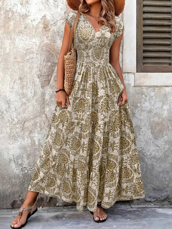 Women's Brittany V-neck maxi boho dress with ornate gold and cream print, flutter sleeves, and tiered skirt.