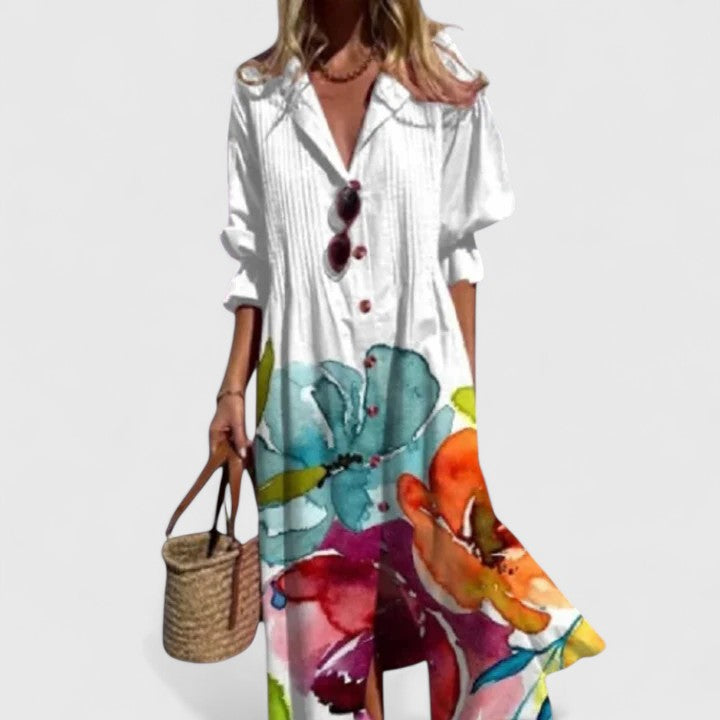 Plus size white boho summer dress with colorful floral print, button-front, long sleeves, and flowing silhouette.