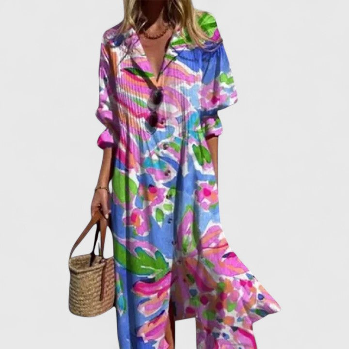 Plus size women's Celestine boho summer dress, colorful artistic print, button-front, long sleeves, flowing silhouette.