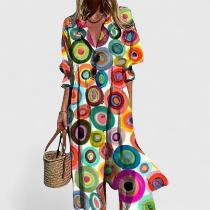 Plus size Celestine boho summer dress with bold, colorful artistic circle print, button-front, and long sleeves.